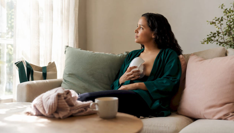 Mother using lactation massager in nursery