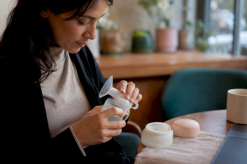 Mother setting up wearable breast pump