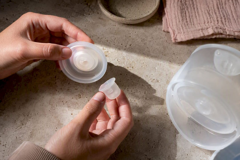 Hands inspecting wearable pump seal components