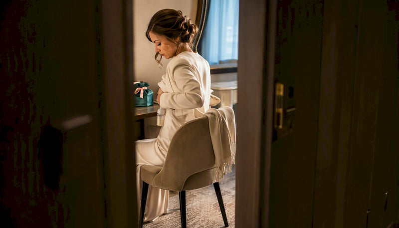 Mother discreetly pumping in bridal suite